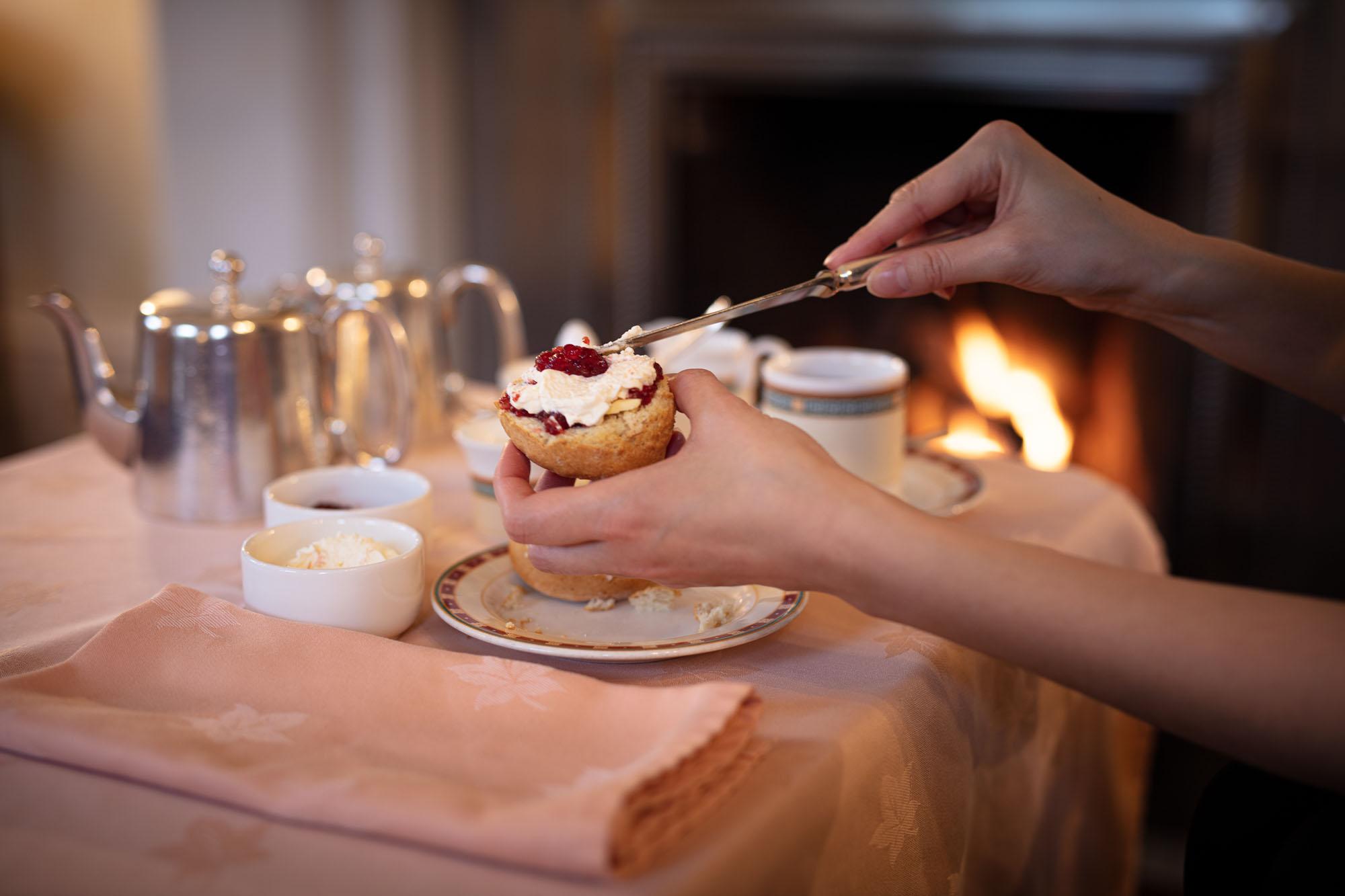 Tea and cream scone by the lounge fire